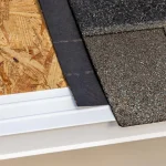 Close-up view of roof layers showing OSB decking, underlayment, asphalt shingles, and drip edge flashing on a residential roof.